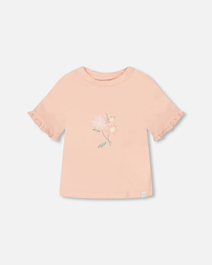 Haut avec volants et imprimé rose pâle en coton biologique
- F30H70-811 - 3 à 12 ans